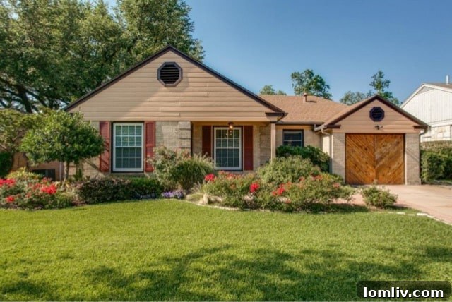 Inviting front entrance with neatly manicured landscaping at 5824 Palm Ln, Dallas