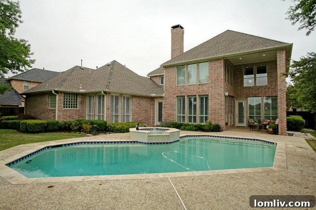 Elegant Backyard with Lush Landscaping and Golf Course Access
