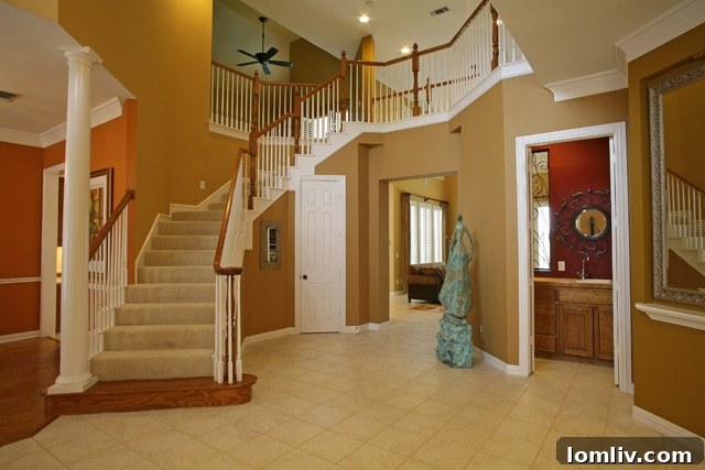 Elegant Foyer with Circular Staircase: First Impression of Luxury