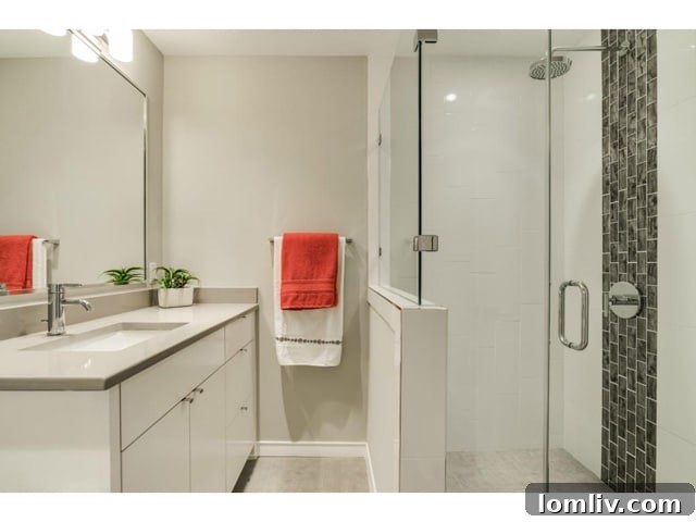 The updated master bathroom, featuring modern fixtures and finishes.