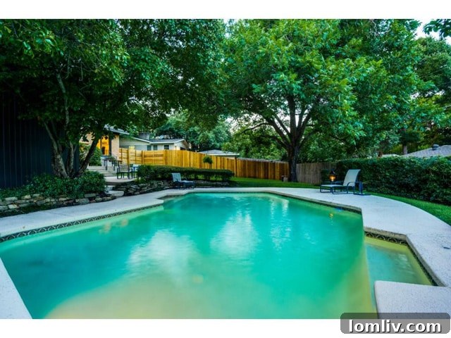 The inviting private swimming pool, a perfect escape in the Dallas heat.