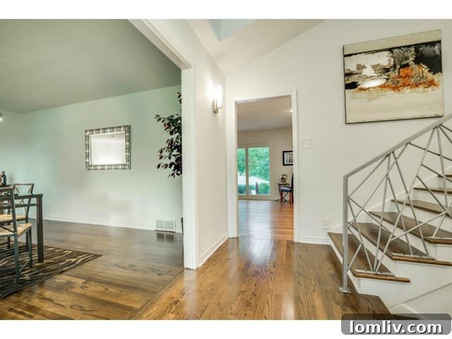 Custom stair rail as a focal point in the split-level home, reflecting sleek, modern design.