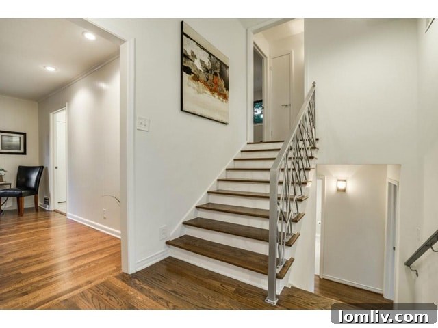 Another view of the elegant staircase, highlighting the seamless transition between levels.