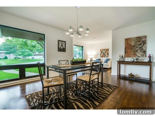 Another perspective of the dining room, showcasing its ample space and natural light.
