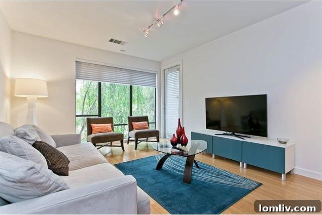 Spacious living room with large windows and balcony access in Dallas condo