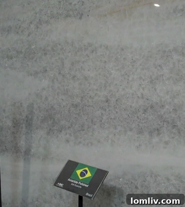 An Anatardite Calcite slab, mislabeled as Quartzite, showing its crystalline structure and potential for etching on a kitchen countertop.