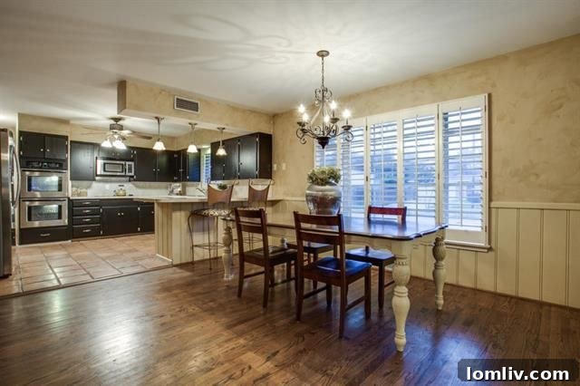 Another perspective of the spacious and well-lit interior of 703 Kirkwood Dr