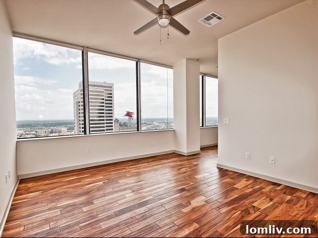 Modern kitchen in an LTV Tower apartment with stainless steel appliances and granite countertops.