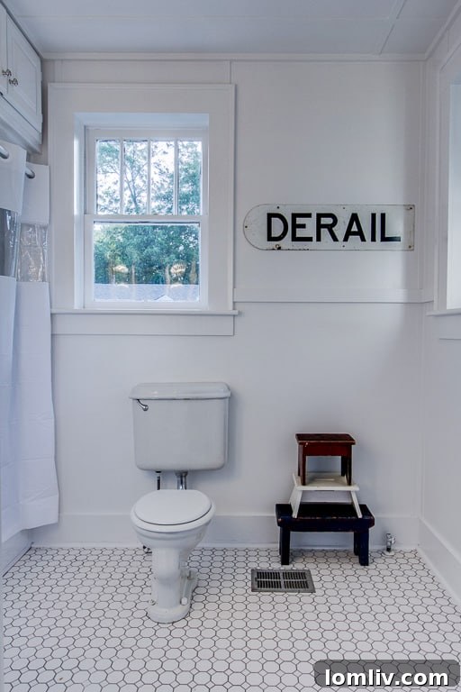Luxurious vintage-inspired bathroom with elegant tile work, modern fixtures, and thoughtful design