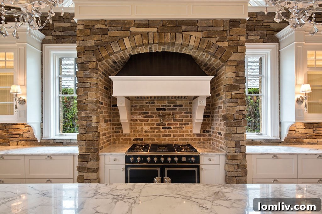 Luxury kitchen by Veranda Designer Homes featuring brick detailing and sleek white cabinetry.