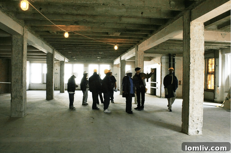 The Stewpot Open Art artists exploring their future art studio on the second floor of 508 Park.