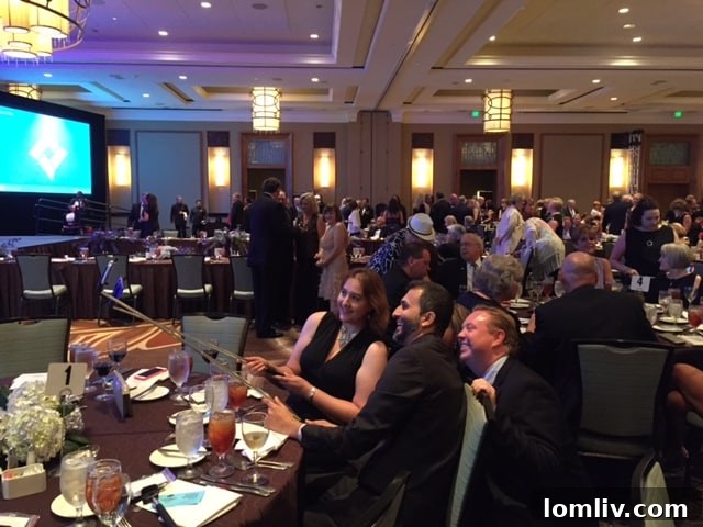 Attendees enjoying selfie sticks at the TAR Gala