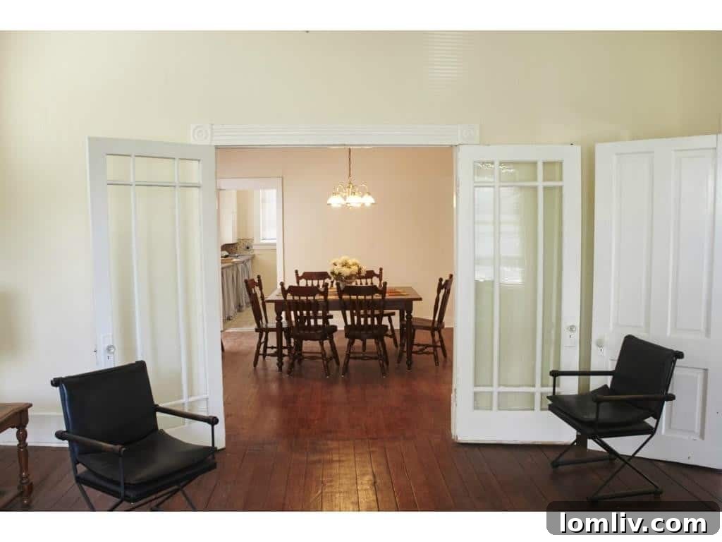 Intricate original molding and doors, characteristic of vintage homes.