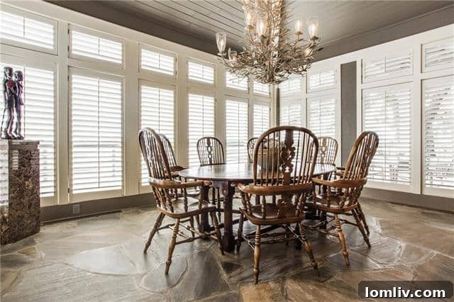 Elegant dining room showcasing panoramic lake views and sophisticated furnishings at Agarita Circle