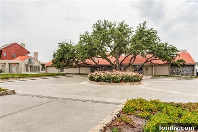 Elegant entrance and manicured driveway of the Possum Kingdom Lake estate at Agarita Circle