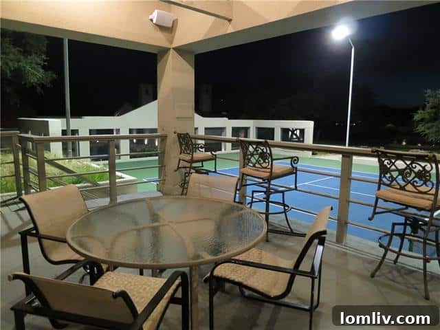 Shaded tennis court pavilion offering relaxation and comfort at the luxury lake house