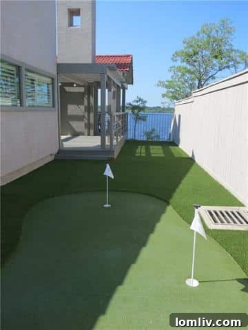 Manicured putting green for golf enthusiasts amidst lush landscaping at the luxury retreat
