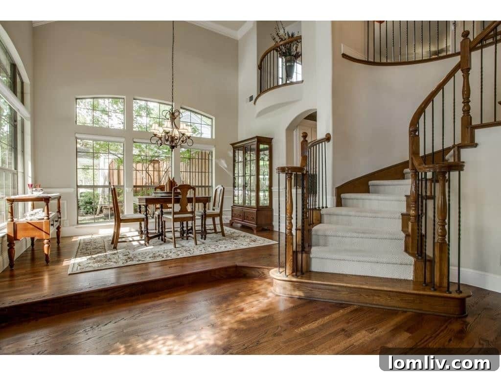 Inwood Home of The Week: Bluffview's Fresh Build Where Location is Everything 3 Elegant Foyer with Sweeping Staircase at 8312 Ridgelea