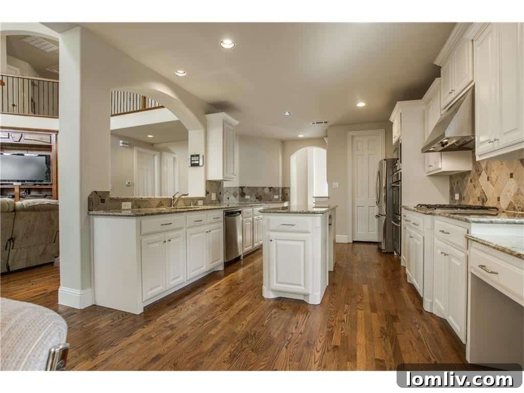 Inwood Home of The Week: Bluffview's Fresh Build Where Location is Everything 10 Gourmet Kitchen Island and Prep Area