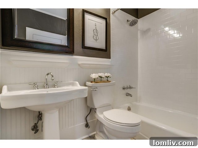 Vintage-inspired bathroom with beadboard and pedestal sink