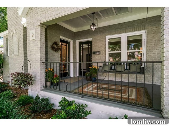 Charming front porch of the renovated 1925 Tudor home in Kessler Square