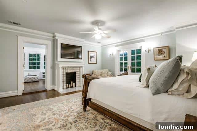 Luxurious master bedroom with plush furnishings and abundant natural light