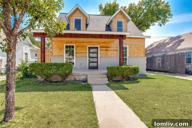The stunning, modern curb appeal of a fully renovated North Oak Cliff home, showcasing a dramatic transformation.