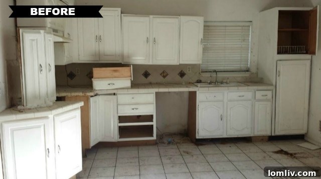 The original kitchen before renovation, highlighting outdated appliances, cramped layout, and general disrepair.