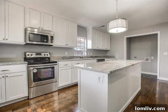 Another perspective of the bright, airy, and inviting kitchen space, emphasizing its openness.