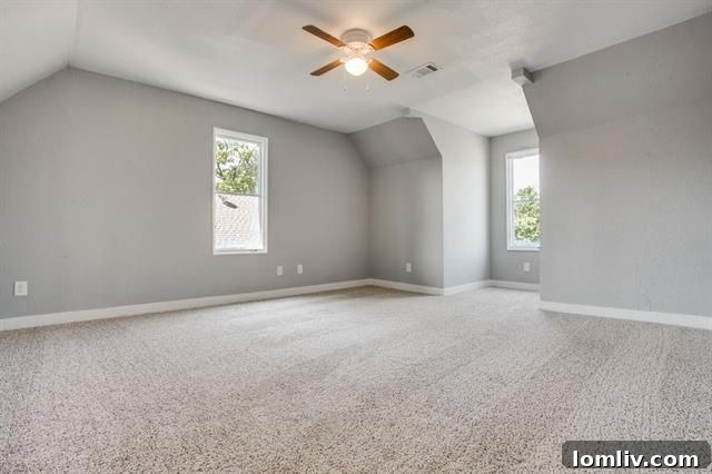 A spacious walk-in shower with exquisite modern tile work, promising a high-end bathing experience.