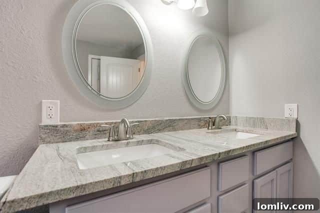 The guest bathroom or powder room, featuring elegant touches and a fresh, clean design.