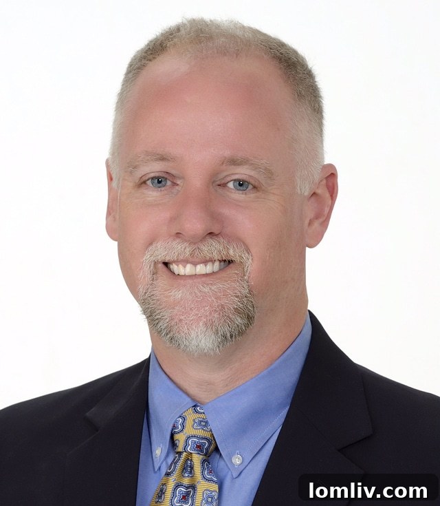 Alan Hopper, a dedicated real estate agent with Ebby Halliday Preston Center, engaging with clients at an event.