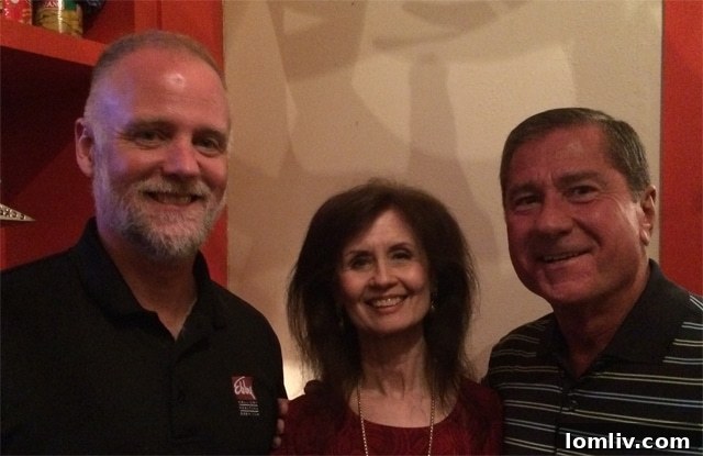 Guests mingling and enjoying themselves at Alan Hopper's client appreciation event.