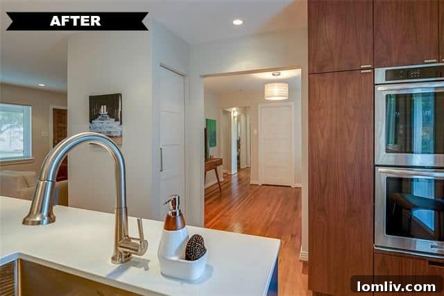 Summer Riggins' Divine Design Debut: A Top-to-Bottom Triumph 12 Detailed shot of the kitchen's elegant marble backsplash and lighting at 561 Classen Drive.