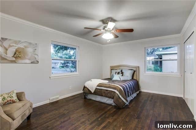 Bright Bedroom with Hardwood Floors and New Ceiling Fan