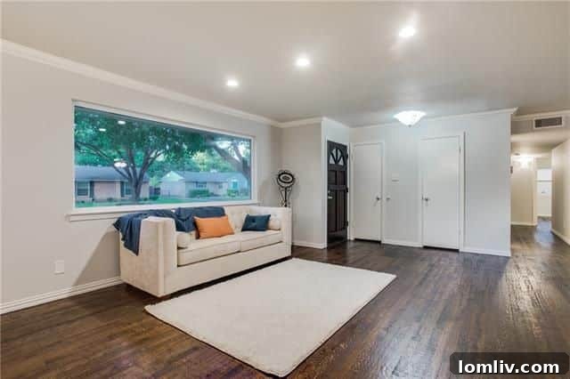 Spacious Living Area with Modern Lighting and Paint