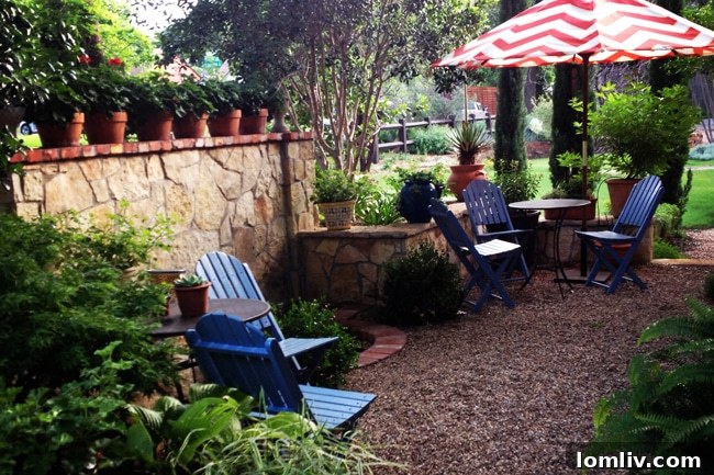 Munsterman/Frederick garden with antique fountain and lush foliage.