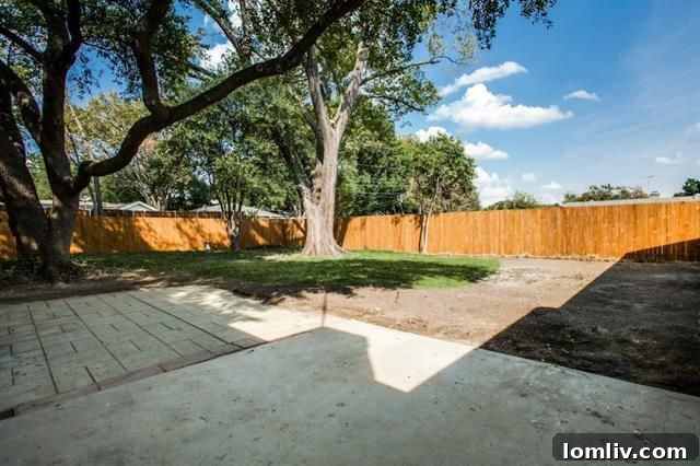 Expansive Rear View of Renovated Home and Yard