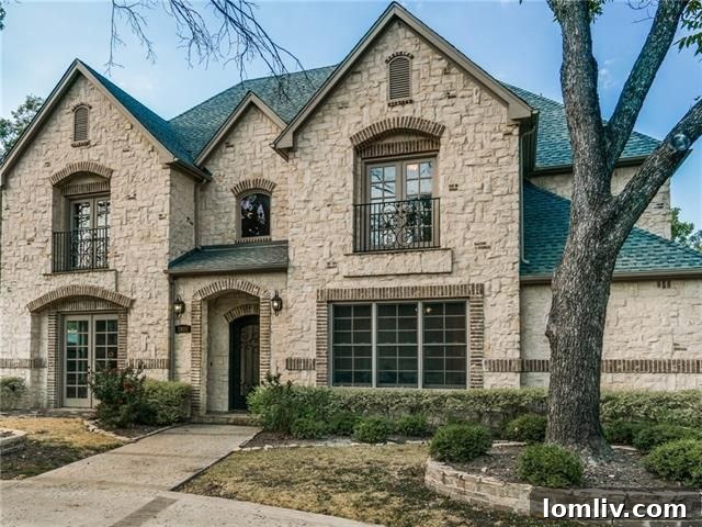 Grand exterior of the custom French Traditional home in University Park