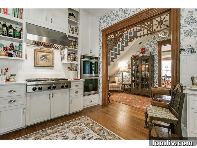 Waxahachie's Victorian Farmhouse A Serendipitous Gem 19 Bright kitchen with blue and white toile wallpaper at 802 Brown Street
