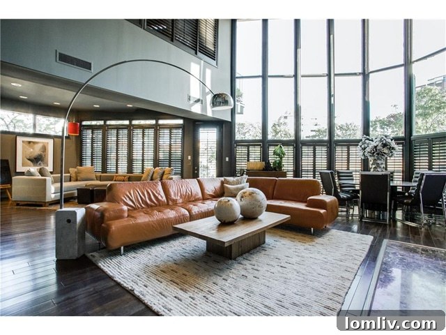 Open Plan Living and Dining Area with Two-Story Windows