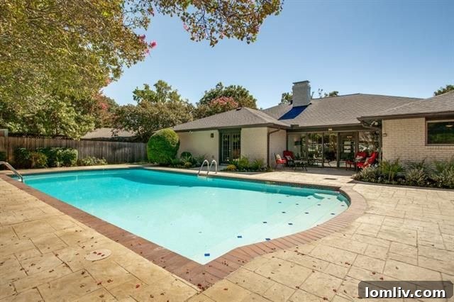 Beautifully updated swimming pool with stamped concrete decking