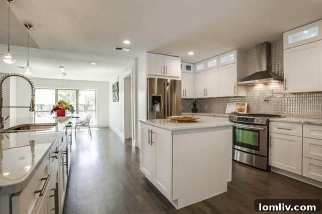 Luxurious kitchen with Carrera Marble and Electrolux appliances at Mimosa Lane