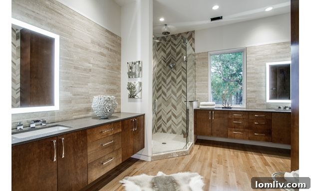 Luxurious Master Bathroom with Stone Tile and Dual Vanities