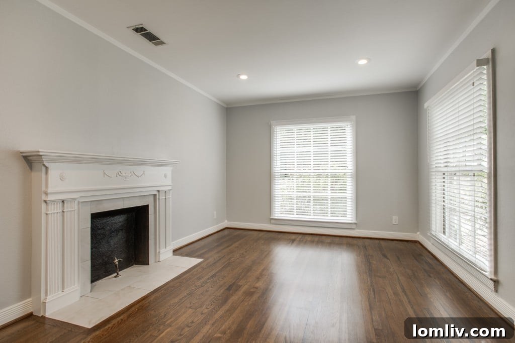 Another perspective of the living room, highlighting natural light and open feel.