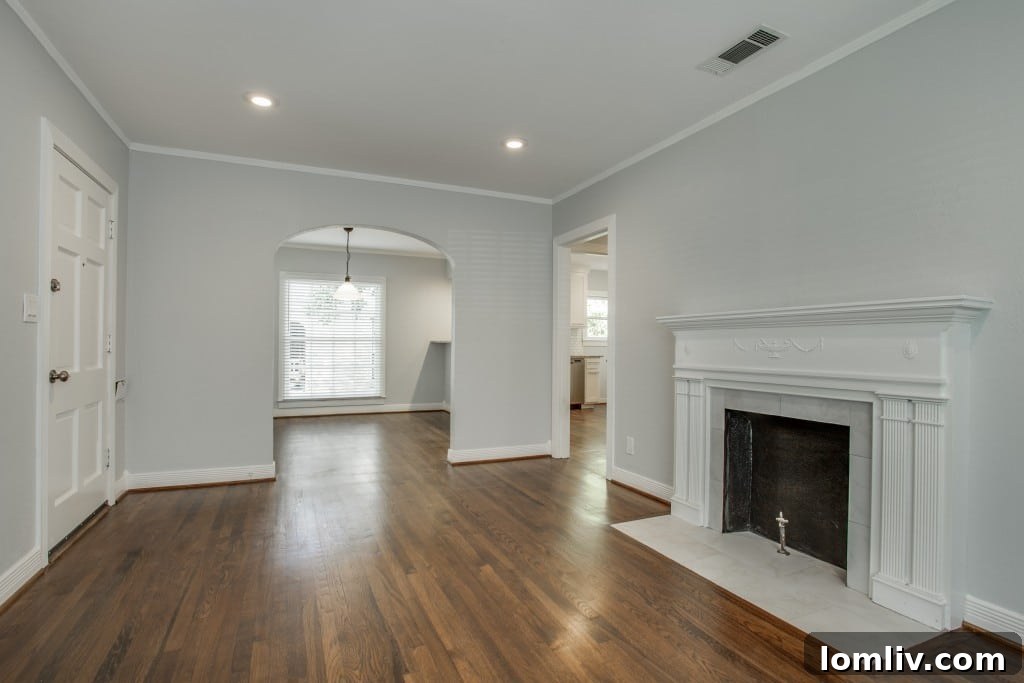 View towards the dining area from the living room, showing the arched doorway.