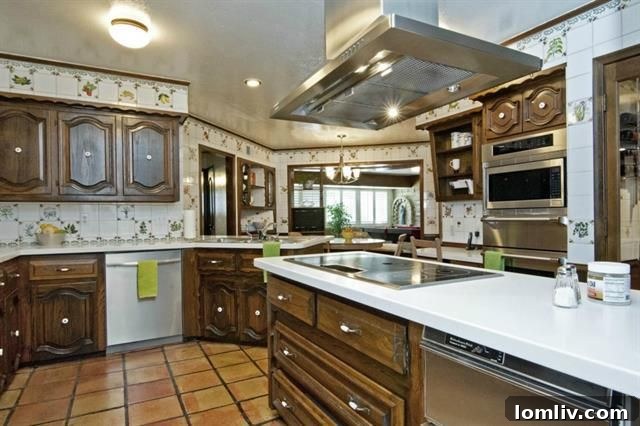 Modern kitchen with new stainless steel appliances at 10815 Royal Park Dr.