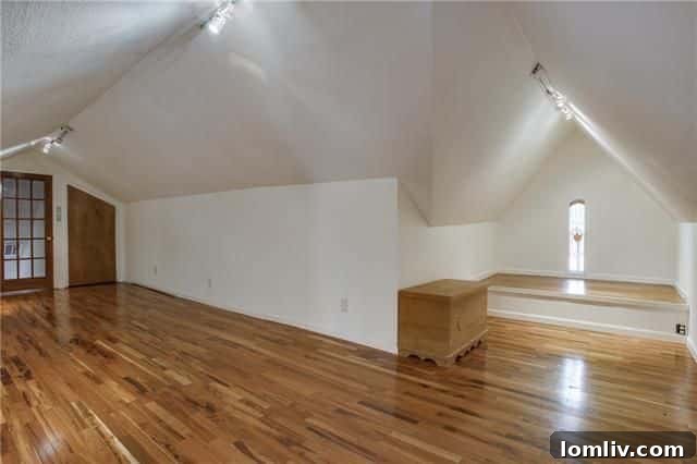 Charming living room with period light fixtures in the Hollywood Heights Tudor.