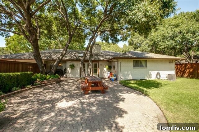 Charming backyard with paver patio and mature shade trees
