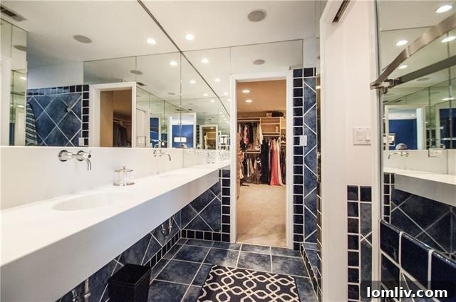 Luxurious master bathroom with multi-head shower and body sprays